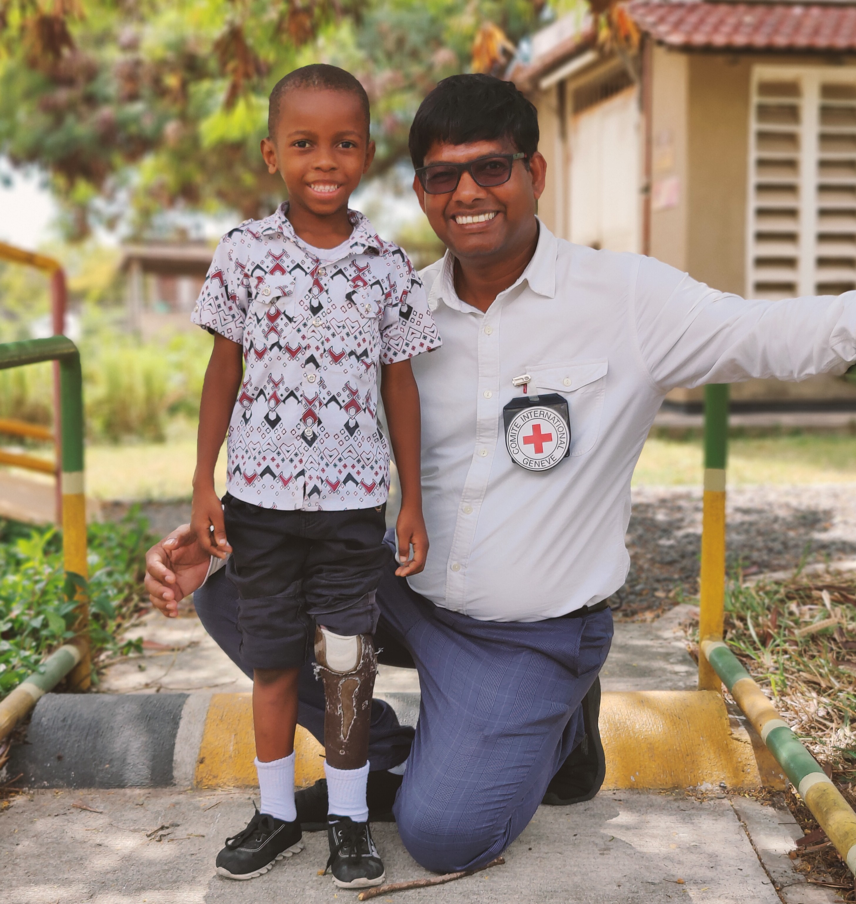 Happy Moments: Subhash with a boy using prosthesis in Tanzania who smiles after receiving rehabilitation services, which makes him smile as well. Happy Moments: Subhash with a boy using prosthesis in Tanzania who smiles after receiving rehabilitation services, which makes him smile as well.